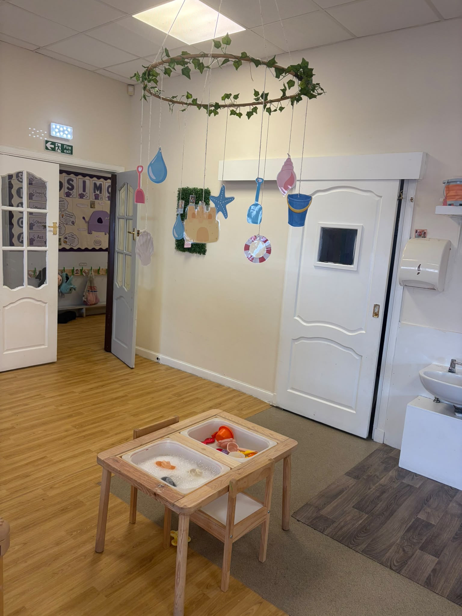 Water and bubble play at the sensory table in the Jelly Babies room